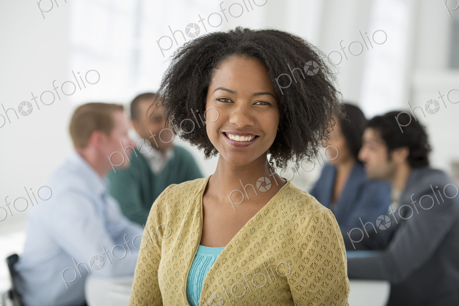 An office in the city. Business. Team meetings. A group sitting down around a table.…