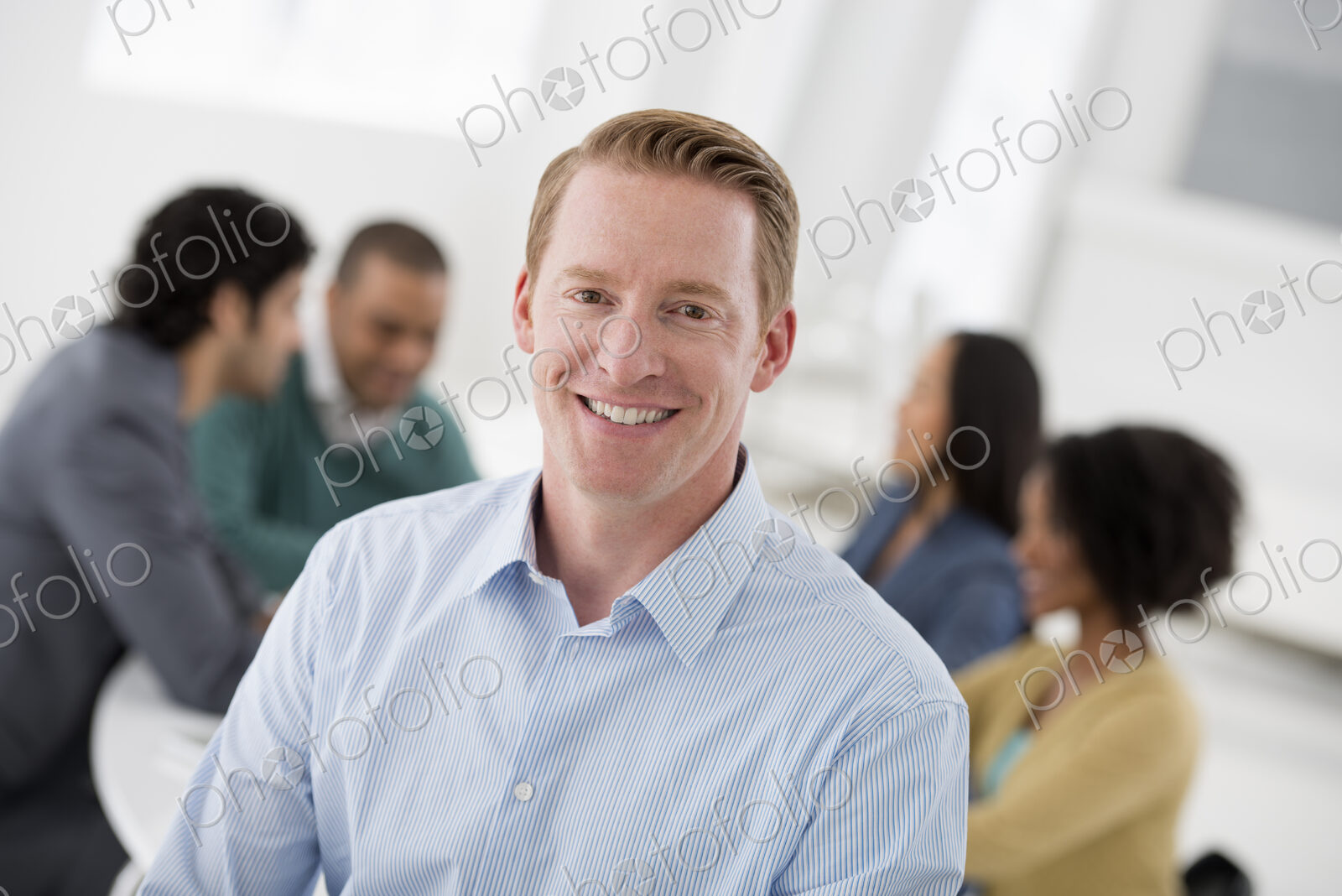 An office in the city. Business. Team meetings. A group sitting down around a table.…