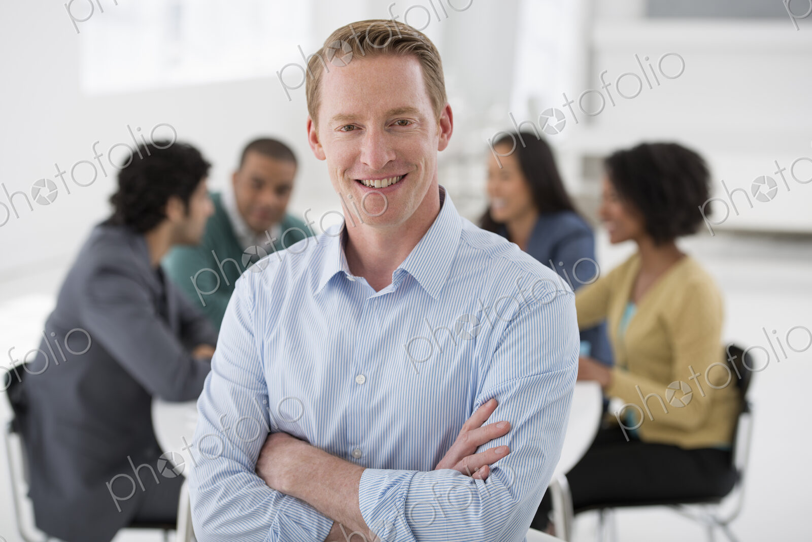 An office in the city. Business. Team meetings. A group sitting down around a table.…