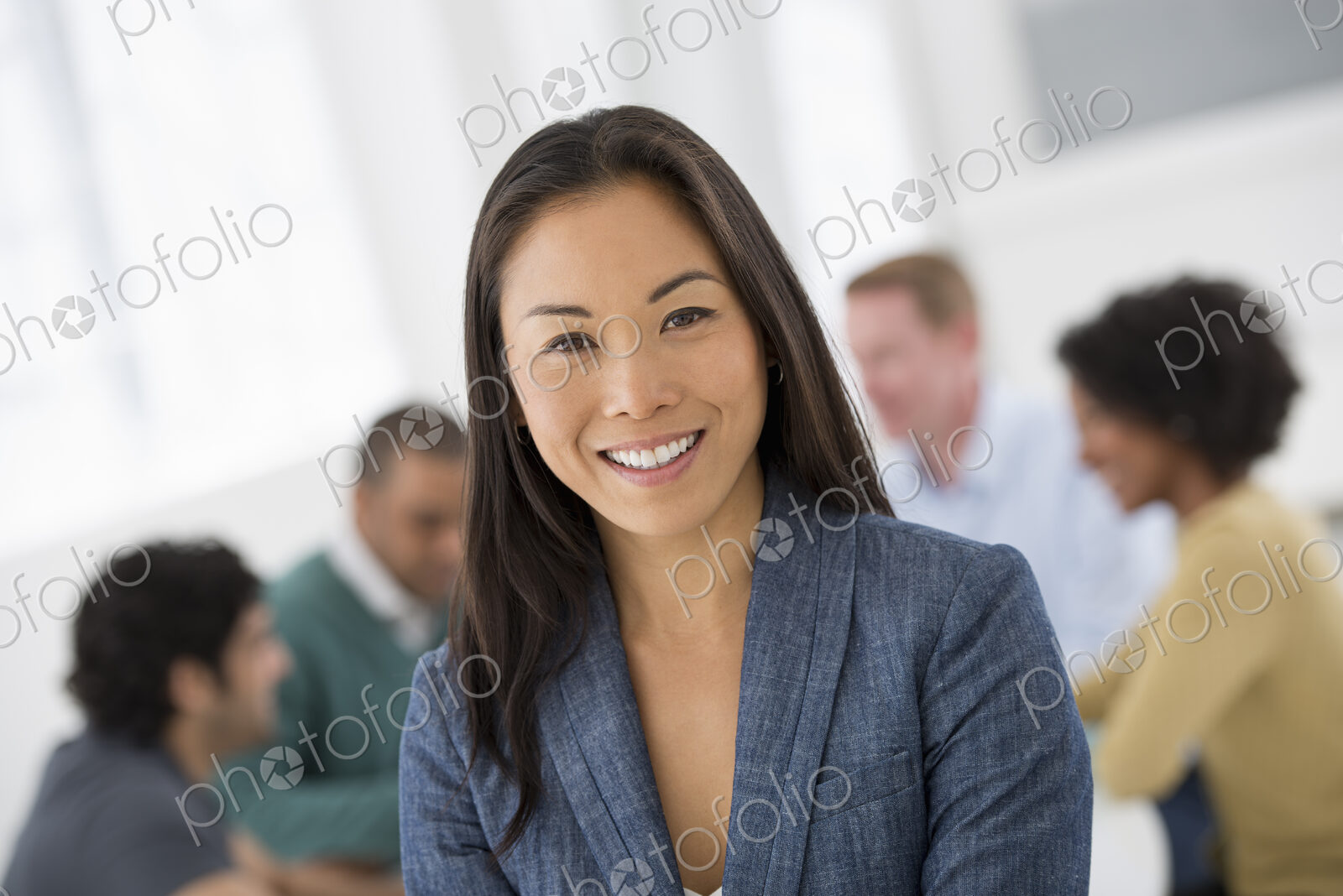 An office in the city. Business. Team meetings. A group sitting down around a table.…