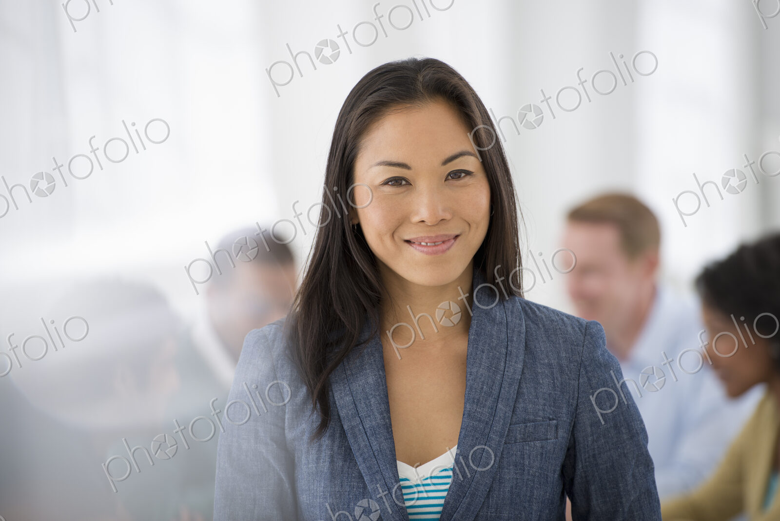 An office in the city. Business. Team meetings. A group sitting down around a table.…