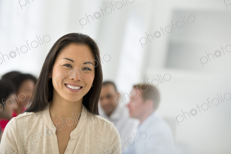 An office in the city. Business. Team meetings. A group sitting down around a table.…
