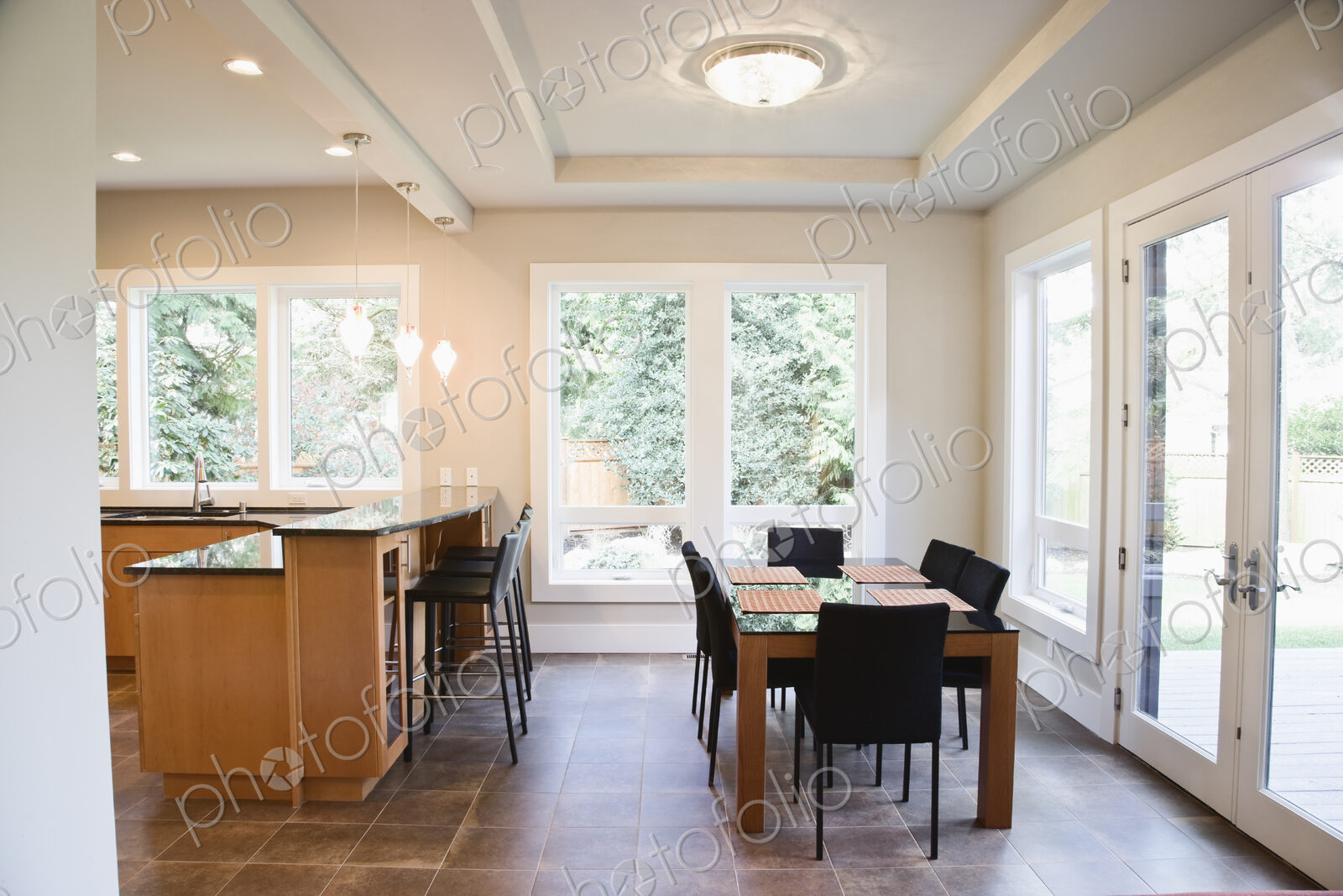 An open plan dining area and breakfast table in a new home.
