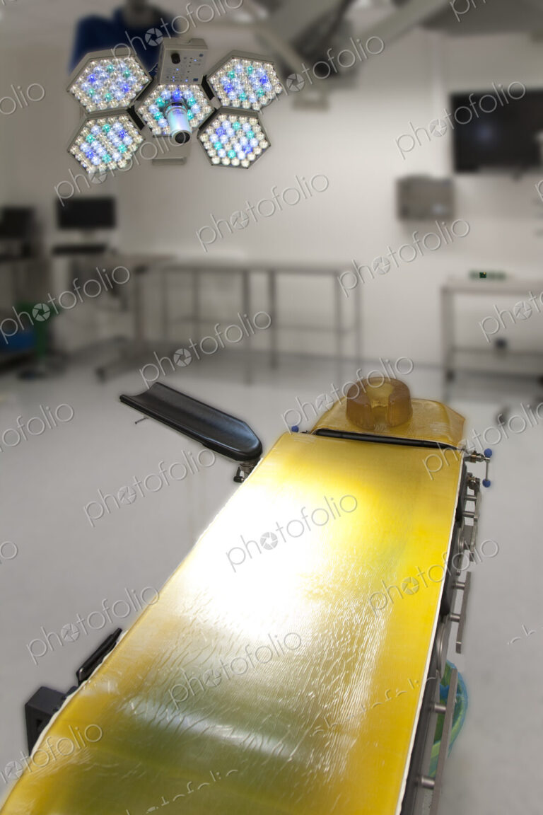 An operating table with a yellow cover in a new hospital facility