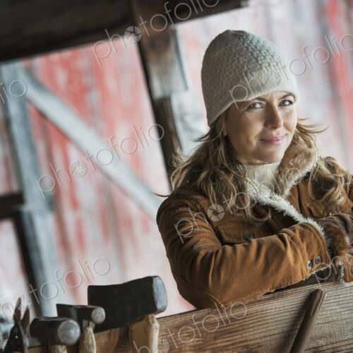 An organic farm in upstate New York, in winter. A woman in a sheepskin coat. A row of… An organic farm in upstate New York, in winter. A woman in a sheepskin coat. A row of…