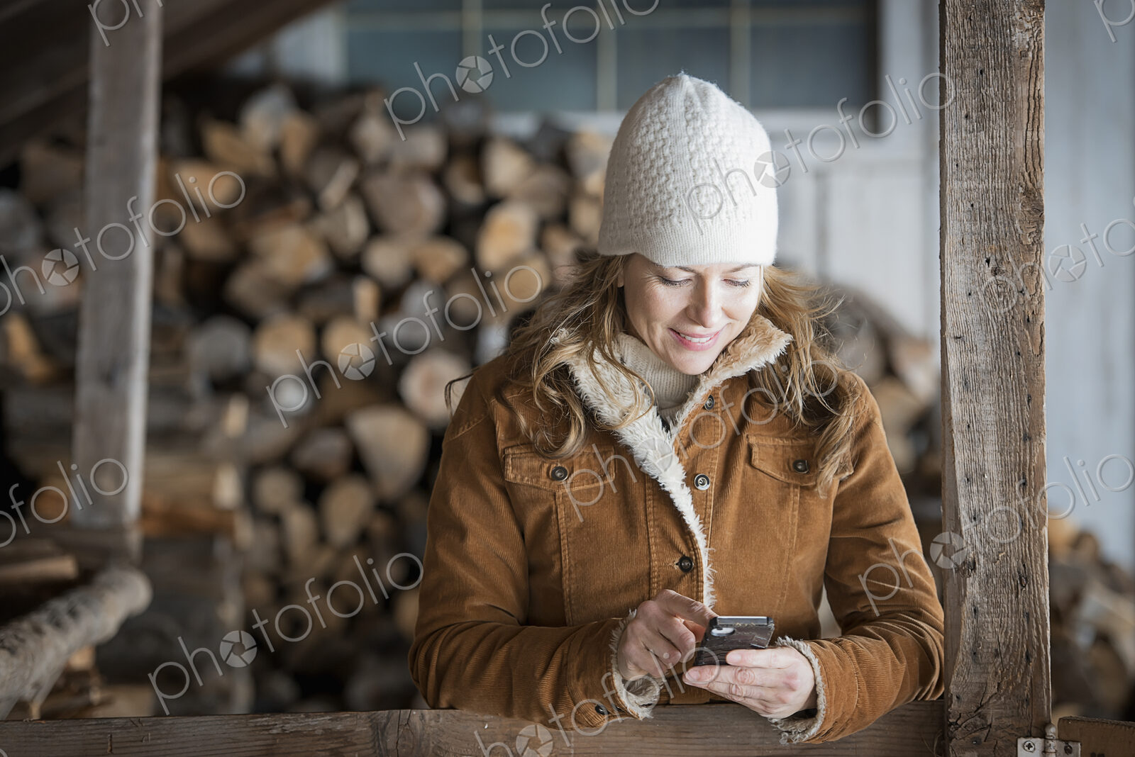 An organic farm in upstate New York, in winter. A woman in sheepskin coat and woollen…