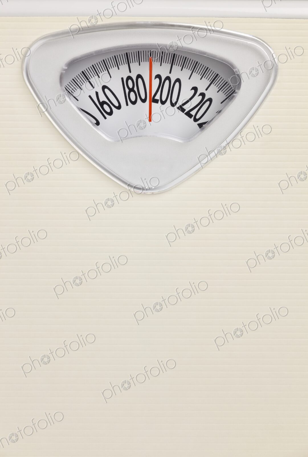 Analog bathroom scale close-up with red needle pointing near 200 pounds. Health and…