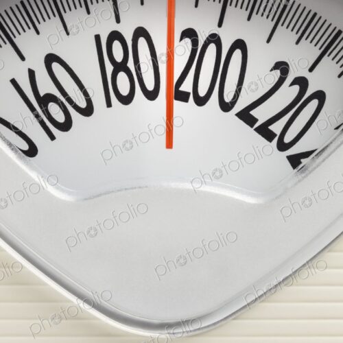 Analog bathroom scale with red needle pointing near 200 pounds. Health, weight…