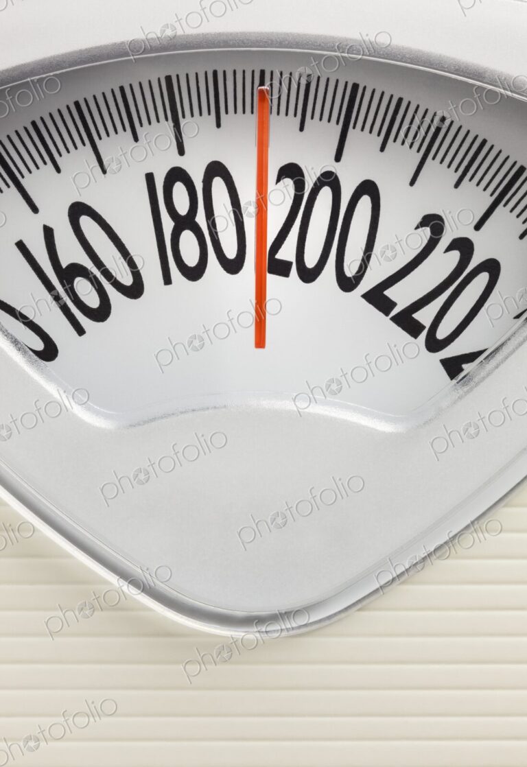Analog bathroom scale with red needle pointing near 200 pounds. Health, weight…