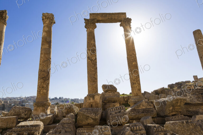 Ancient ruin of colonnade with architrave fragments and columns.