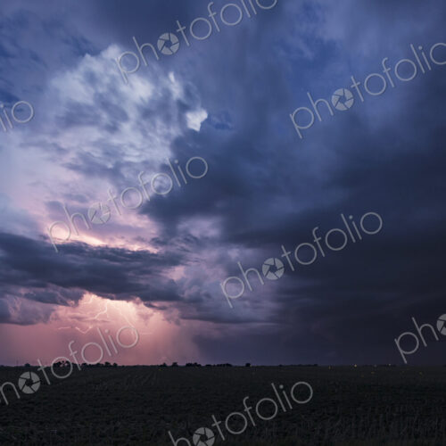 Approaching Storm with Lightning, a sky of black and grey clouds, and lightning…
