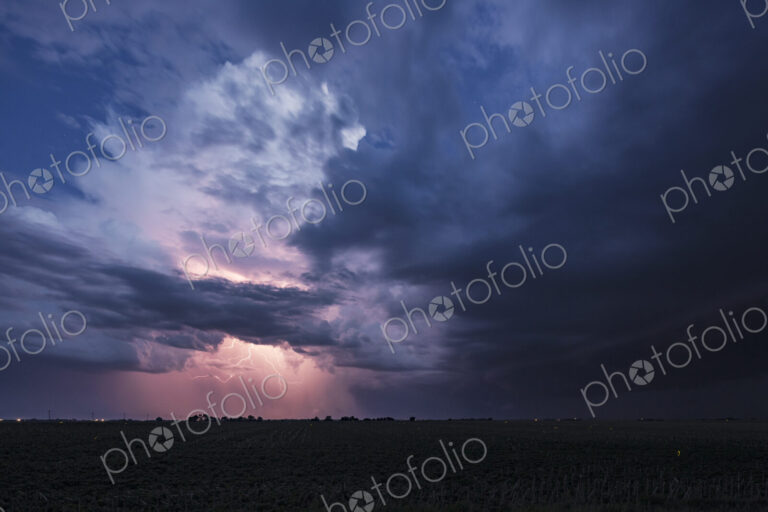 Approaching Storm with Lightning, a sky of black and grey clouds, and lightning…