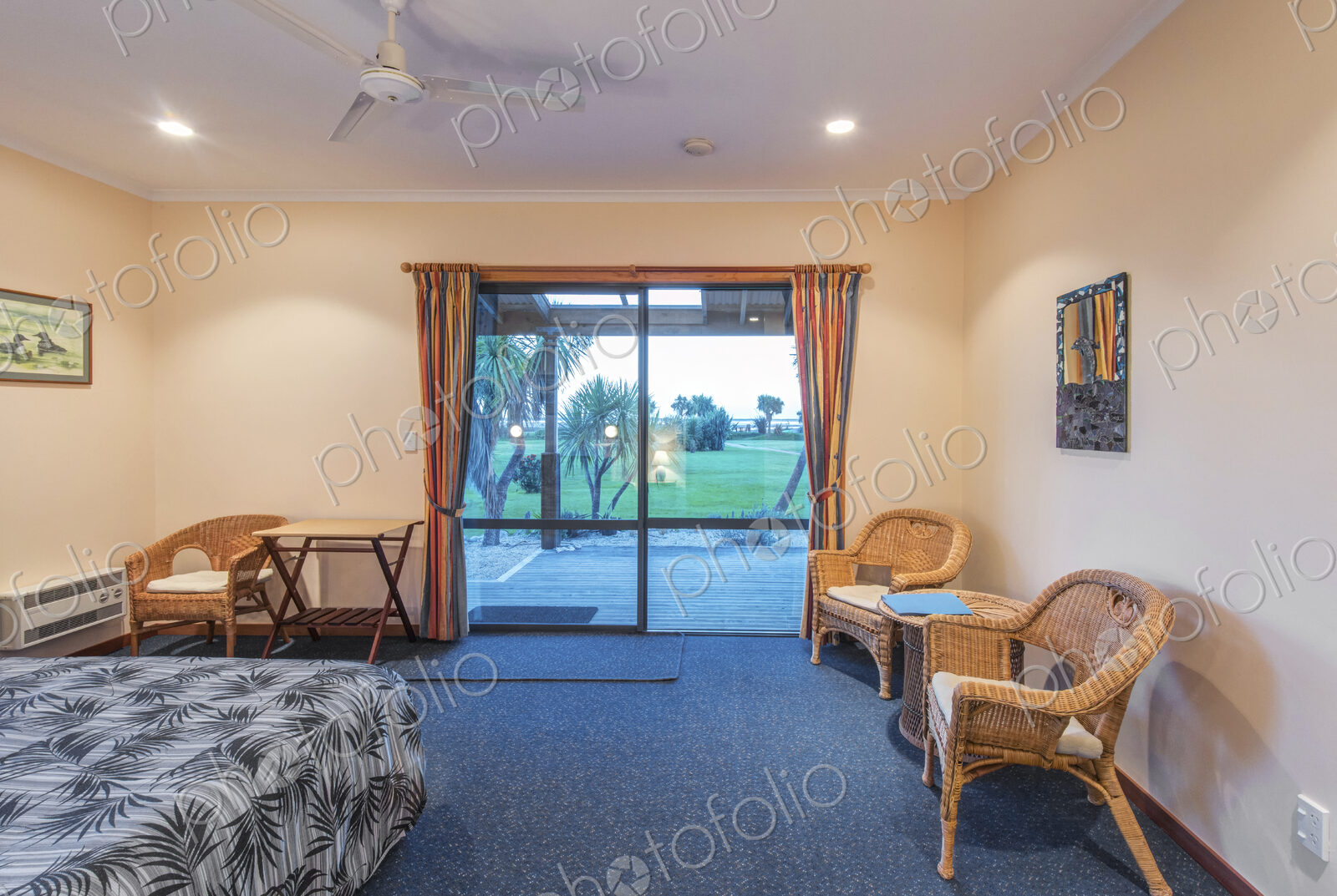 Armchair and bed in hotel room