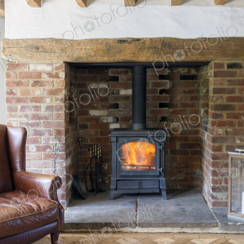 Armchair and fireplace in living room