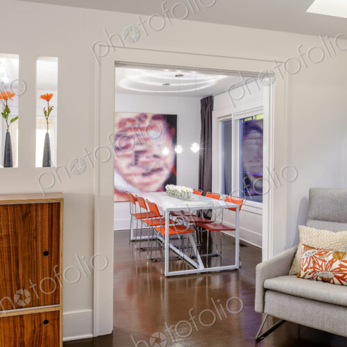 Armchair near entrance to modern dining room
