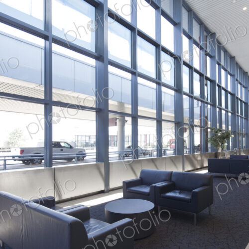 Armchairs and sofas in an empty lounge at an airport