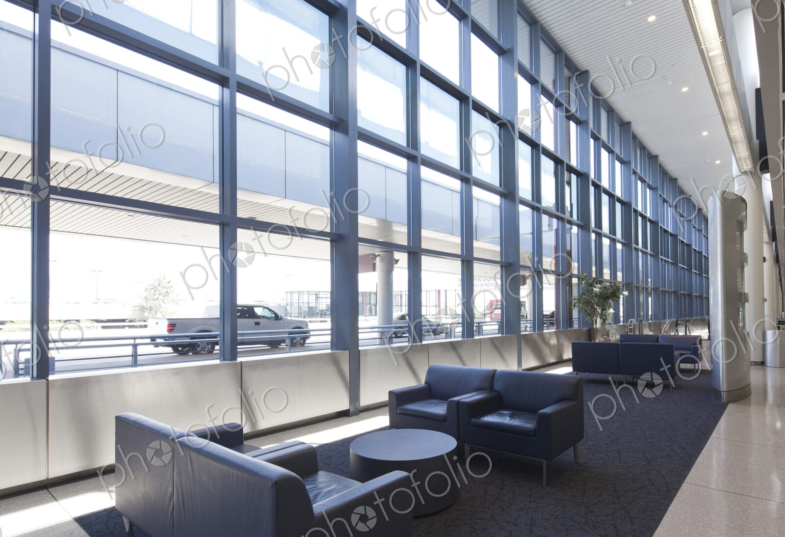 Armchairs and sofas in an empty lounge at an airport