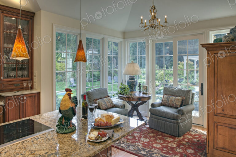 Armchairs by kitchen in luxury house