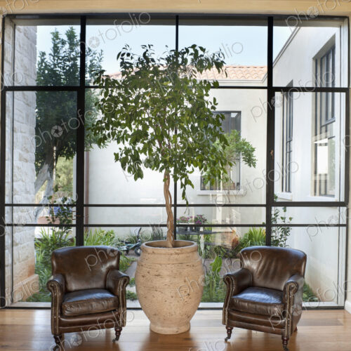 Armchairs in Front of a Large Window Armchairs in Front of a Large Window