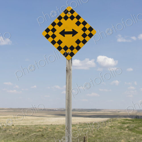 Arrow intersection sign and rural farmland, Arrow intersection sign and rural farmland,