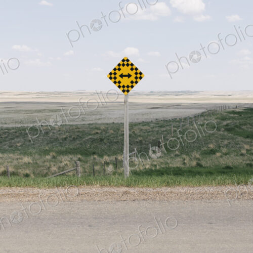 Arrow intersection sign and rural farmland, Arrow intersection sign and rural farmland,