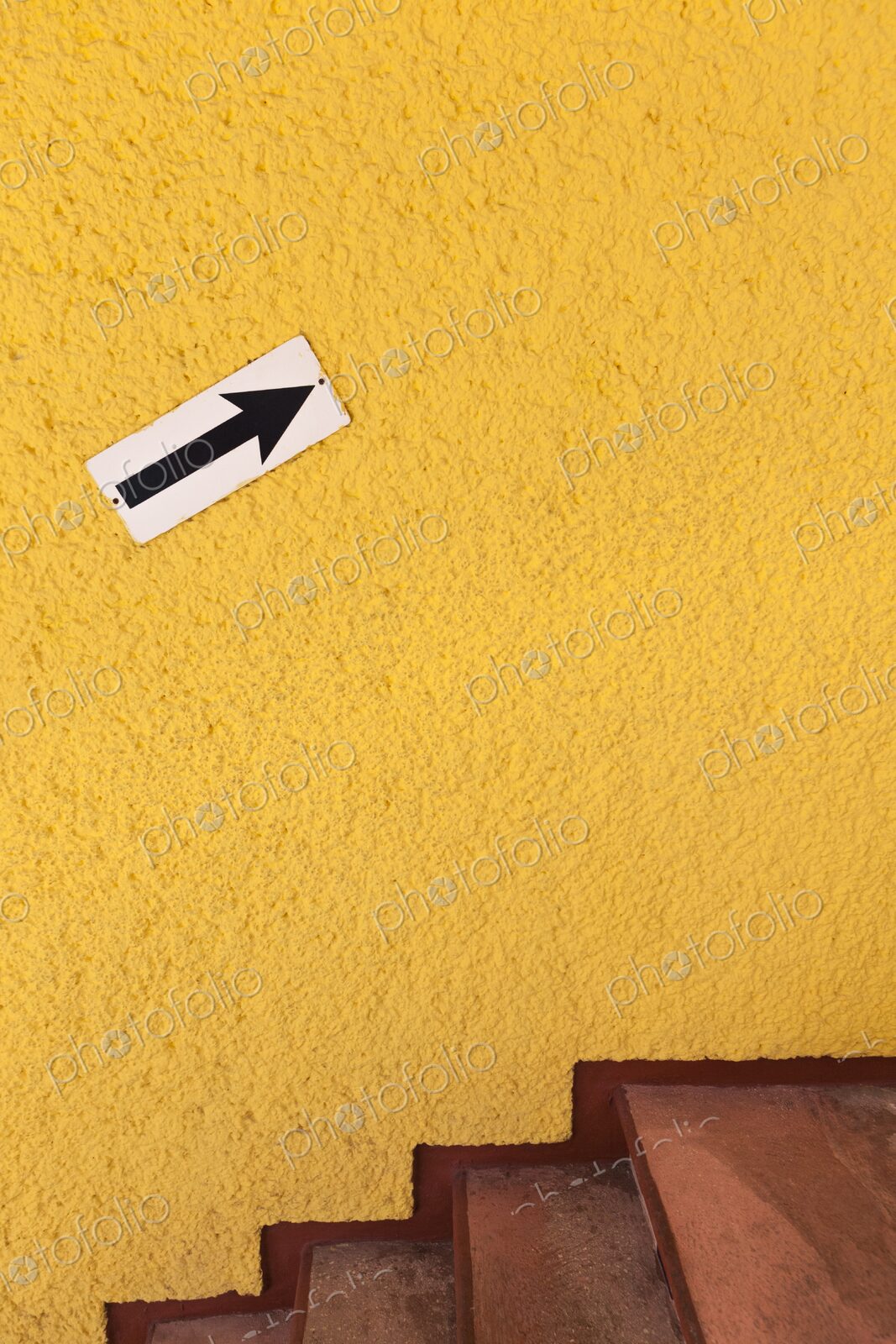 Arrow pointing up on bright yellow wall, Cancun, Yucatan Peninsula, Quintana Roo