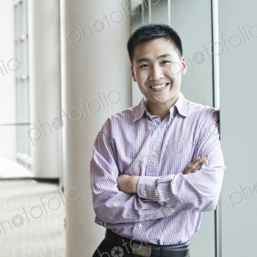 Asian businessman in a business center lobby. Asian businessman in a business center lobby.