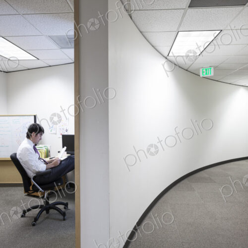 Asian businessman working alone in his office Asian businessman working alone in his office