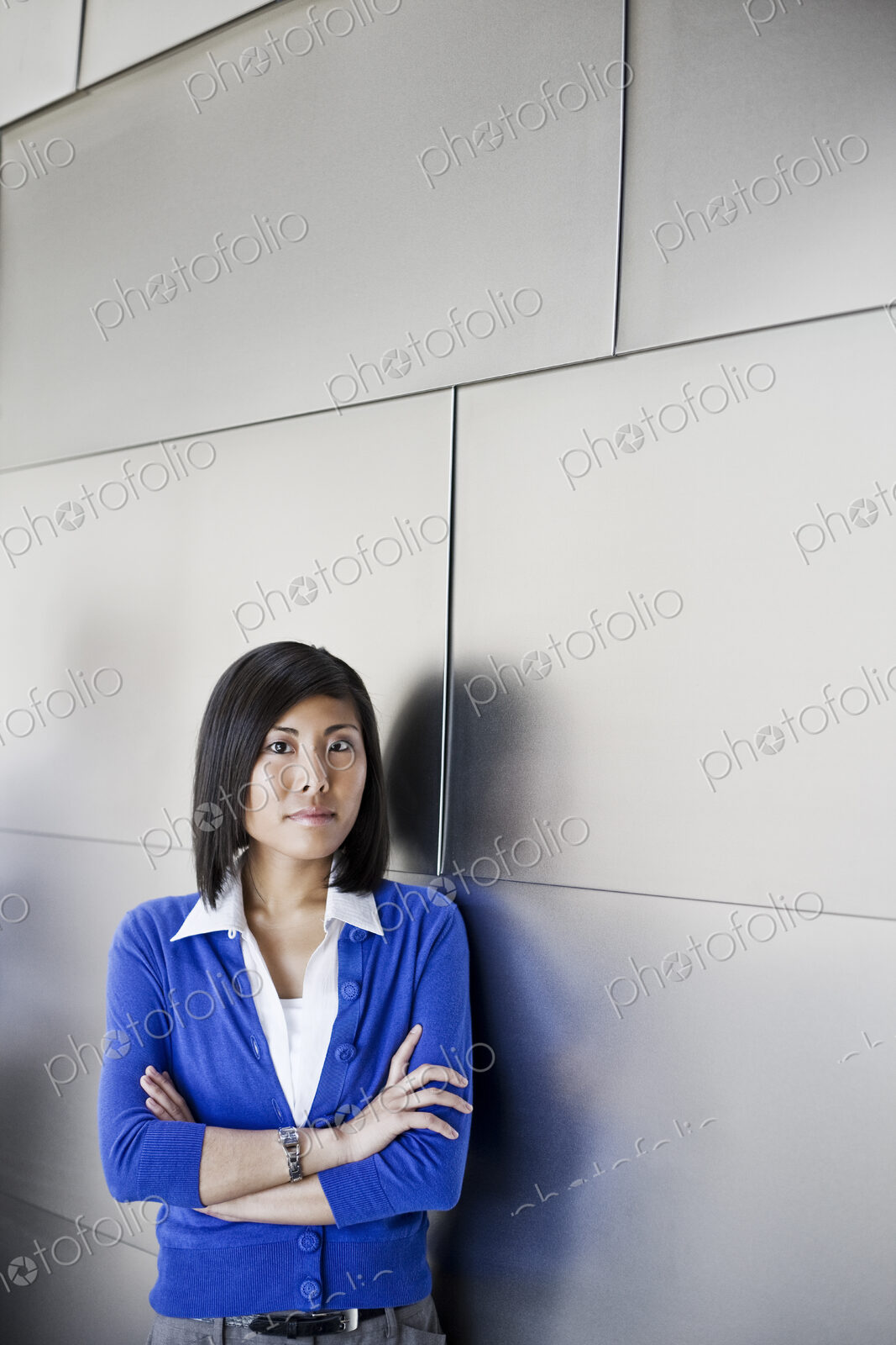 Asian businesswoman in the lobby of a large office building.