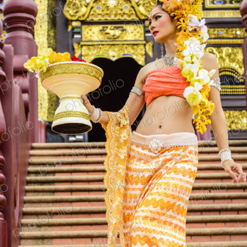 Asian woman at ornate Buddhist temple, Chiang Mai, Chiang Mai, Thailand Asian woman at ornate Buddhist temple, Chiang Mai, Chiang Mai, Thailand