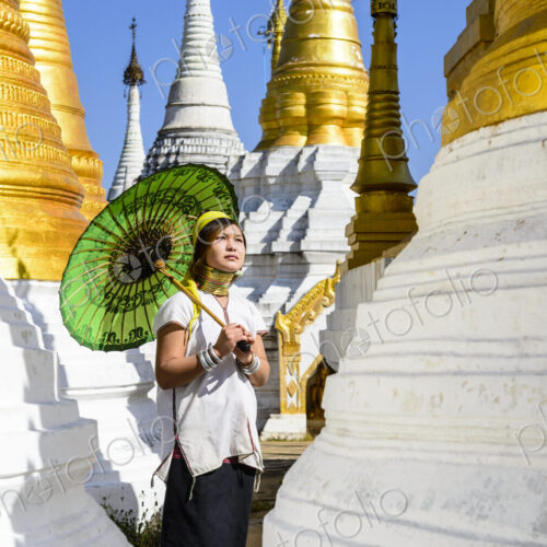 Asian woman carrying parasol at temple Asian woman carrying parasol at temple