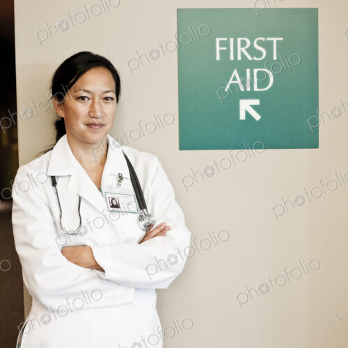 Asian woman doctor in lab coat with stethescope. Asian woman doctor in lab coat with stethescope.