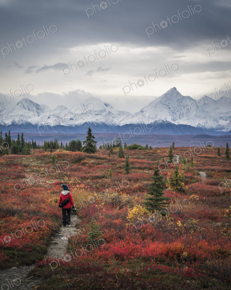 Asian woman hiking near mountains