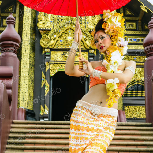 Asian woman with parasol on stairs of ornate Buddhist temple, Chiang Mai, Chiang Mai,… Asian woman with parasol on stairs of ornate Buddhist temple, Chiang Mai, Chiang Mai,…