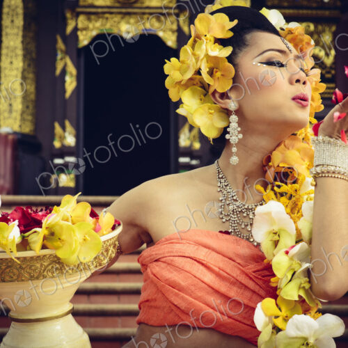 Asian woman with petals on stairs of ornate Buddhist temple, Chiang Mai, Chiang Mai,… Asian woman with petals on stairs of ornate Buddhist temple, Chiang Mai, Chiang Mai,…