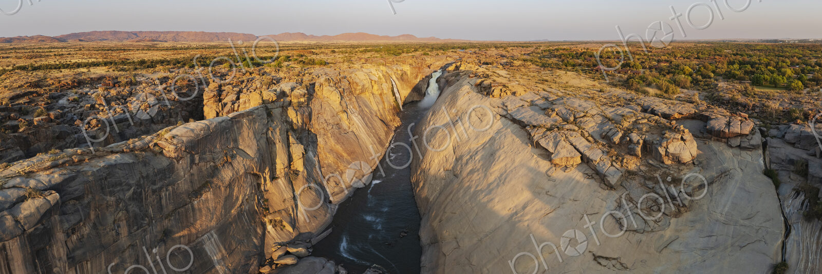 Augrabies Falls at Sunset, elevated view of a deep gorge and the Orange River. Gorge…