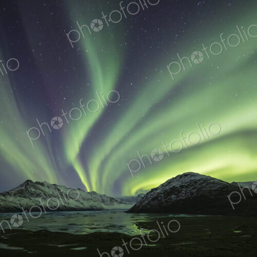 Aurora Borealis, the natural light display in the sky caused by charged particles from… Aurora Borealis, the natural light display in the sky caused by charged particles from…