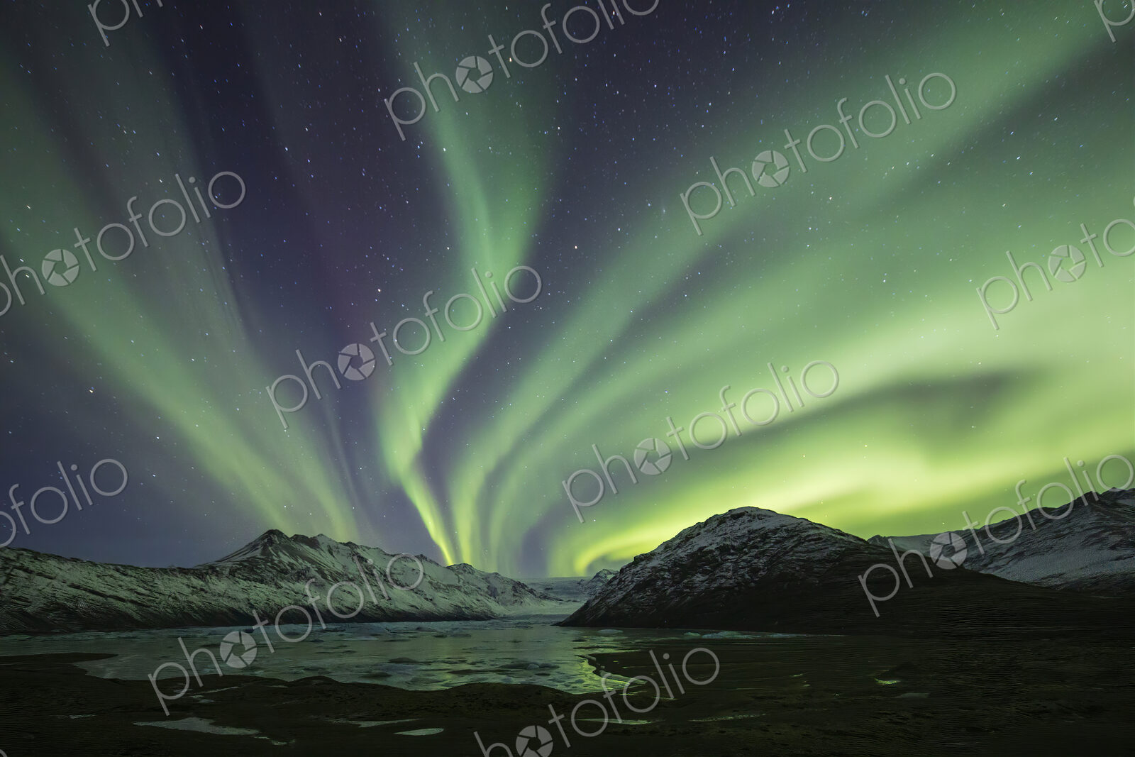 Aurora Borealis, the natural light display in the sky caused by charged particles from…