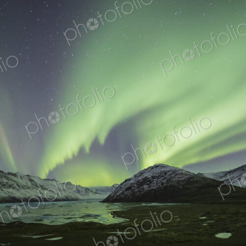 Aurora Borealis, the natural light display in the sky caused by charged particles from… Aurora Borealis, the natural light display in the sky caused by charged particles from…