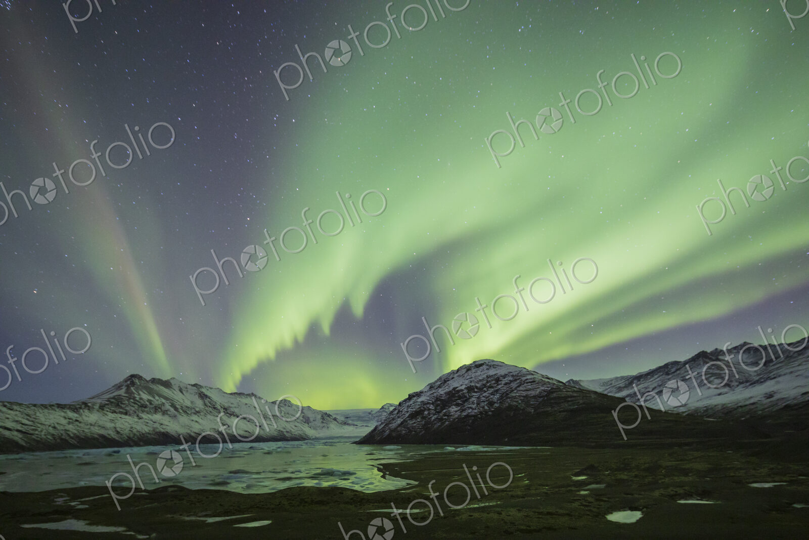 Aurora Borealis, the natural light display in the sky caused by charged particles from…