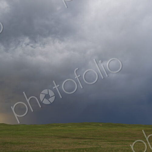 Back Side of a Receding Storm, clouds reaching to the ground on the horizon, North…