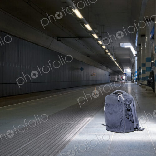 Backpack left unattended on an underground railway station in plain sight, under a… Backpack left unattended on an underground railway station in plain sight, under a…
