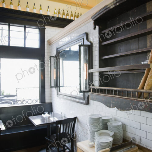 Baguettes in wooden wall rack at French Restaurant. Baguettes in wooden wall rack at French Restaurant.