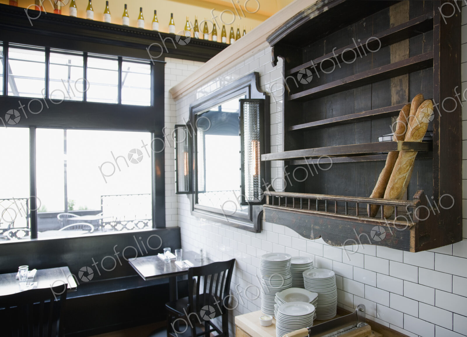 Baguettes in wooden wall rack at French Restaurant.