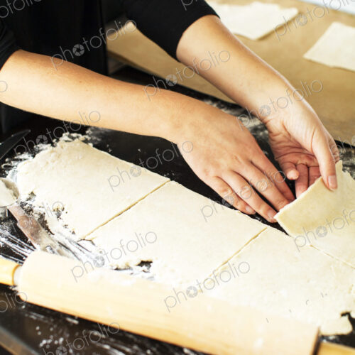 Baker cutting pie dough