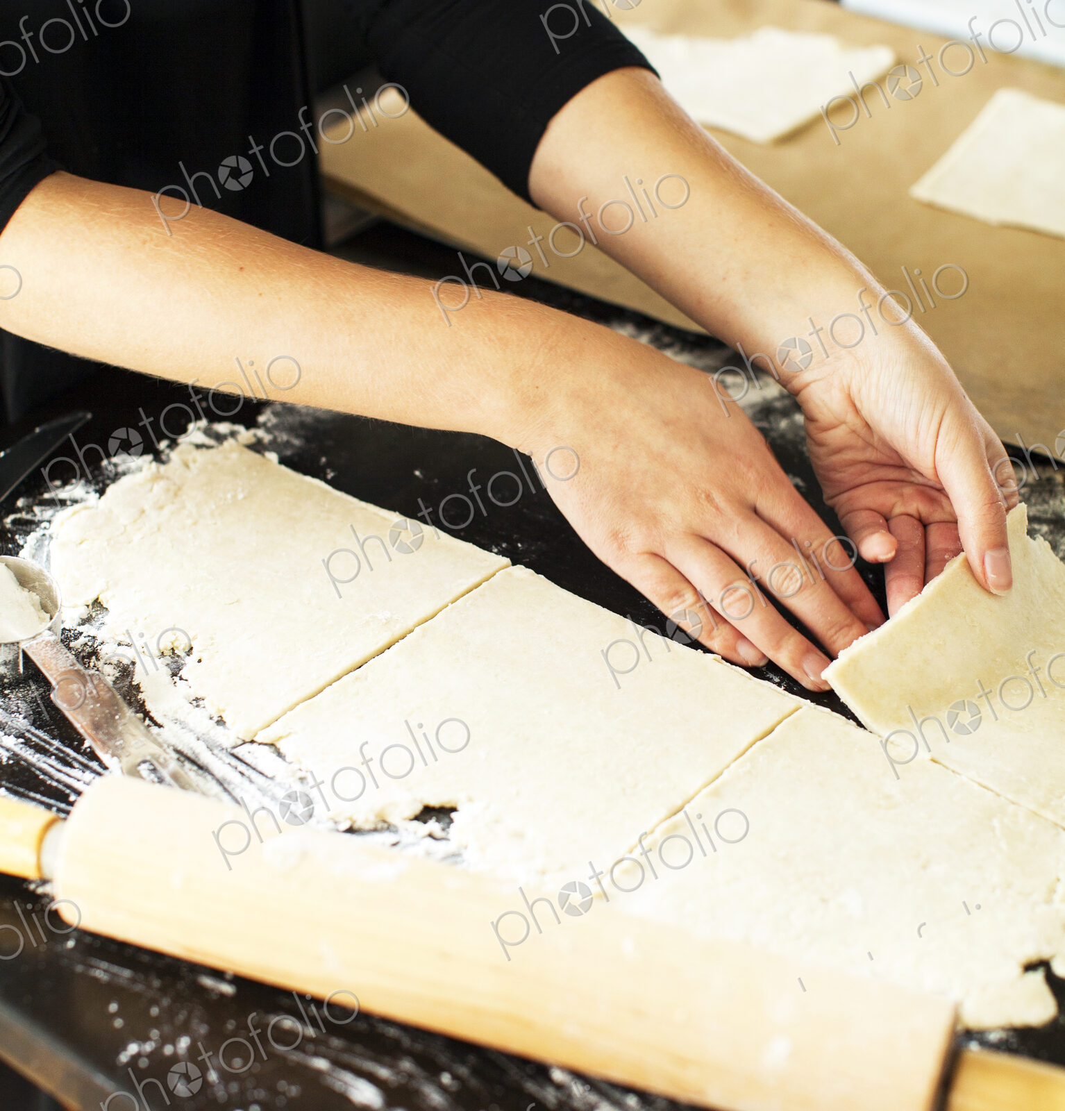 Baker cutting pie dough