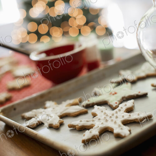 Baking tray of organic homemade Christmas cookies in the shapes of icicles and stars. Baking tray of organic homemade Christmas cookies in the shapes of icicles and stars.