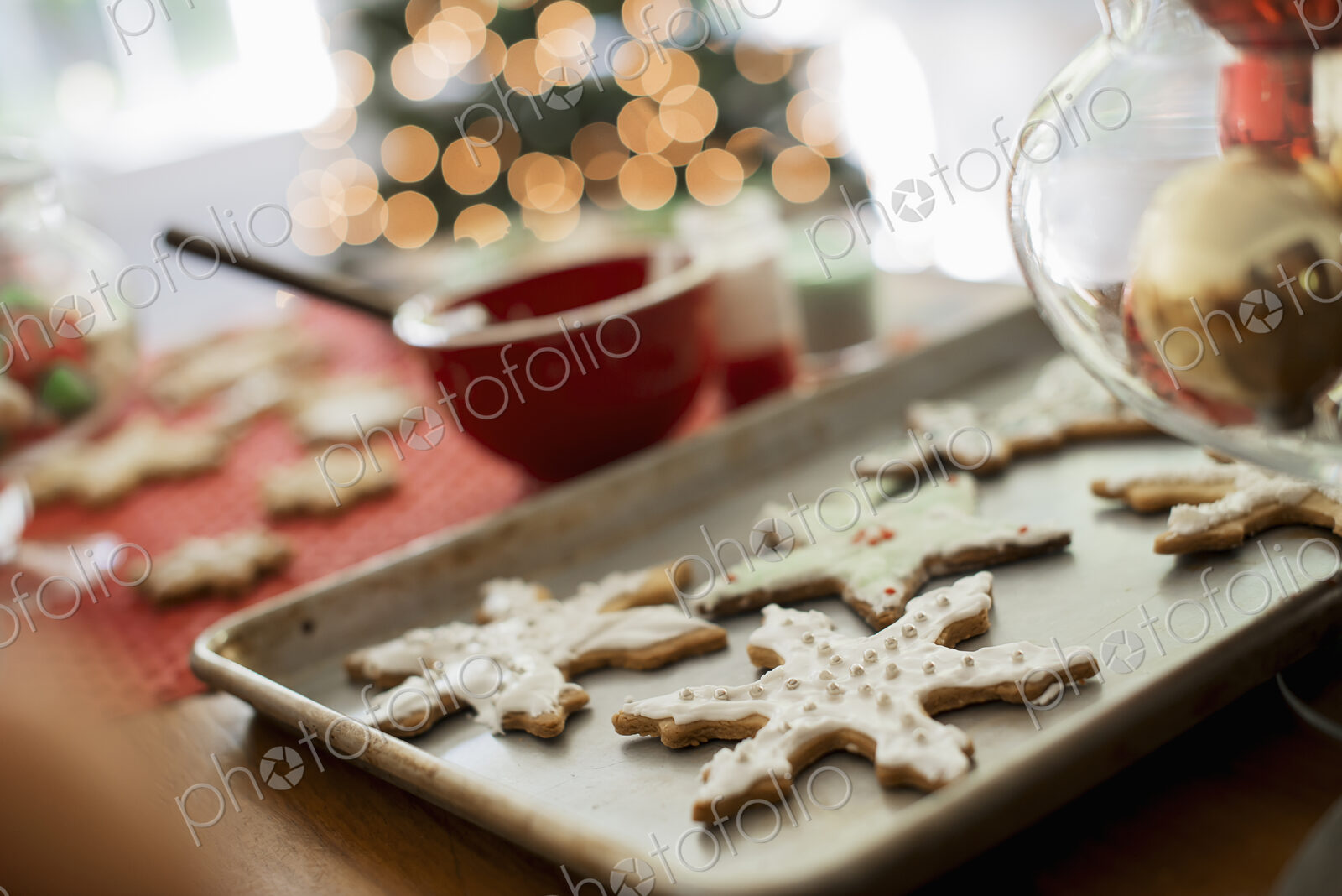 Baking tray of organic homemade Christmas cookies in the shapes of icicles and stars.