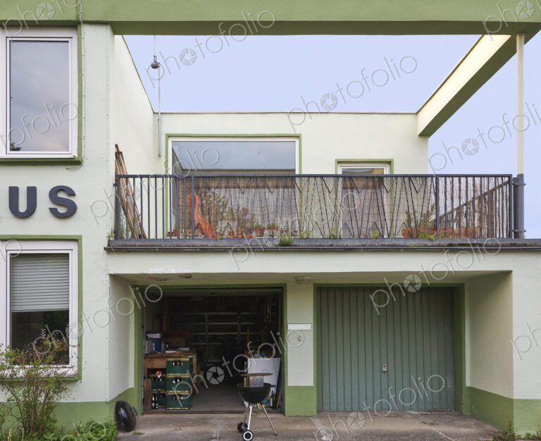 Balcony and open garage of retro home
