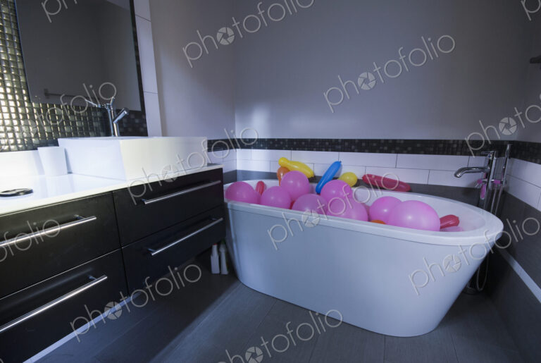 Balloons in a Bathtub in a modern bathroom